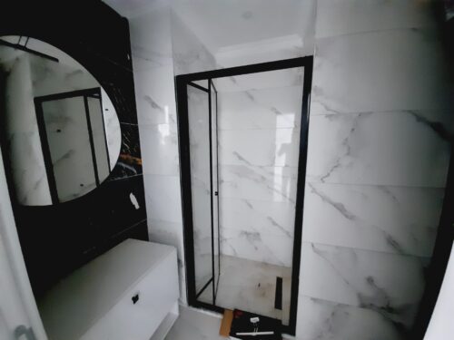 A modern 1+1 apartment in the brand-new residential complex Exodus Resort Comfort City, located in Mahmutlar, Alanya.